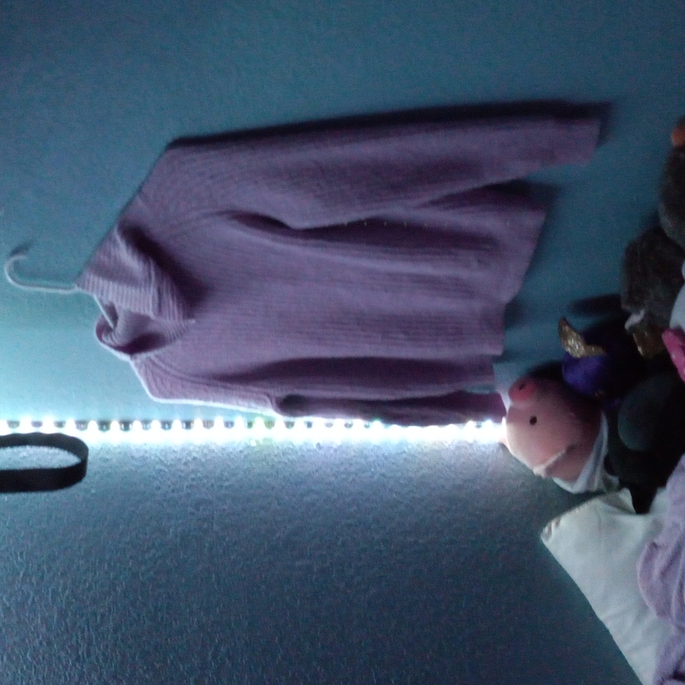 I'm selling a purple turtle neck sweater